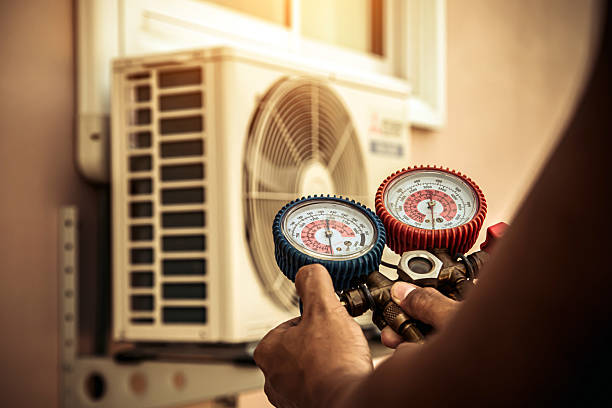 Professional Air Conditioning Service technician working in Cold Brook, NY